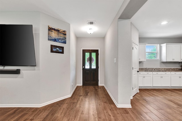 30000 Round Up Dr, Waller, TX 77484 - entryway with wood finished floors, baseboards, and visible vents