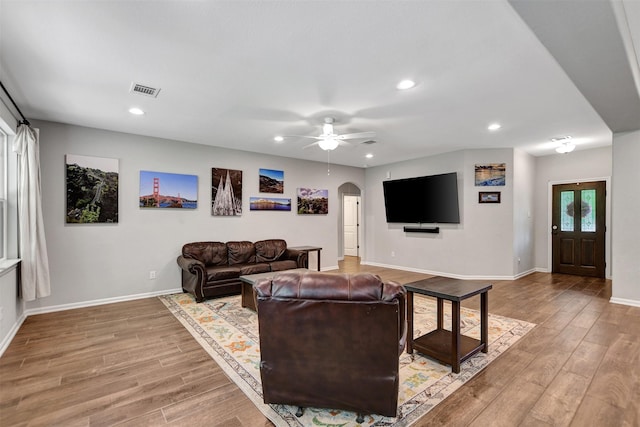 30000 Round Up Dr, Waller, TX 77484 - living room featuring baseboards, recessed lighting, a ceiling fan, light wood-style floors, and arched walkways