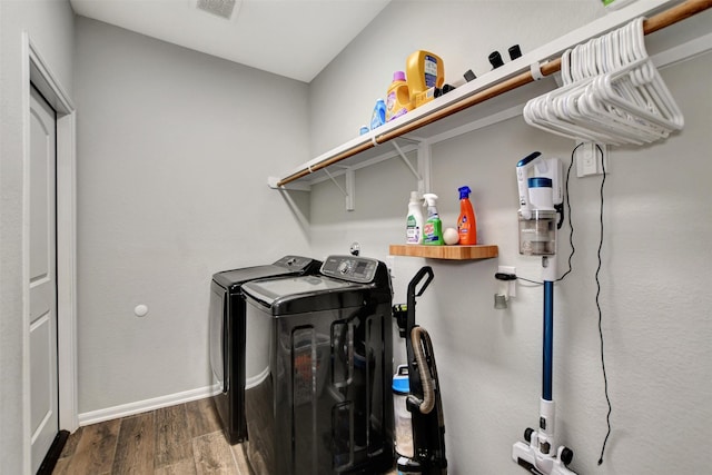 30000 Round Up Dr, Waller, TX 77484 - clothes washing area with baseboards, visible vents, laundry area, washing machine and clothes dryer, and wood finished floors