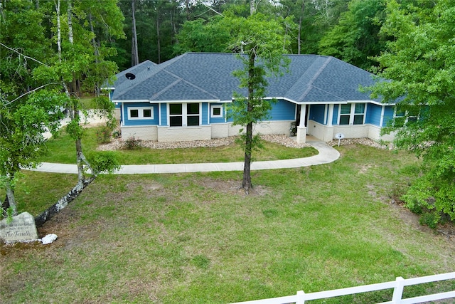 30000 Round Up Dr, Waller, TX 77484 - ranch-style house with brick siding, a front yard, roof with shingles, and fence