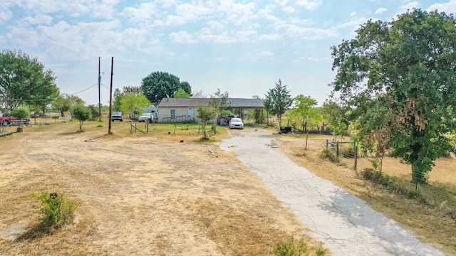 view of street featuring aphalt driveway