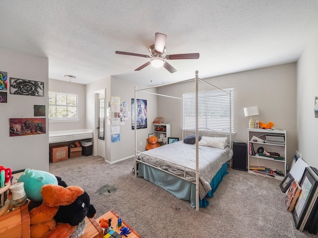 22403 Red River Dr, Katy, TX 77450 - carpeted bedroom with a textured ceiling and ceiling fan