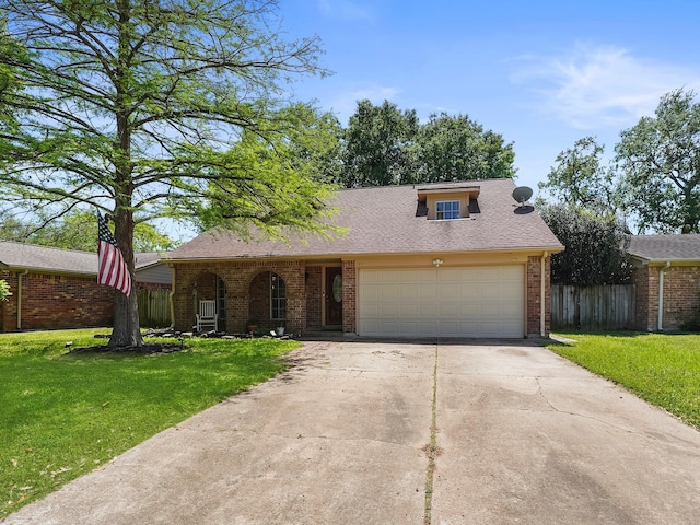 22403 Red River Dr, Katy, TX 77450 - ranch-style house featuring driveway, an attached garage, a front lawn, brick siding, and fence