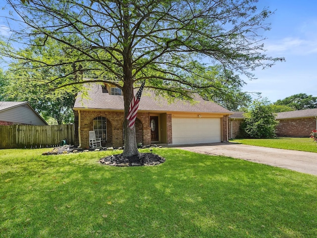 22403 Red River Dr, Katy, TX 77450 - view of front of property with a garage, a front yard, brick siding, and fence