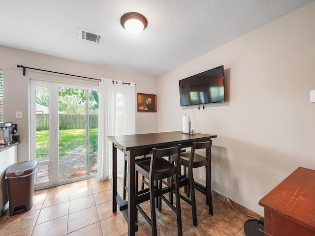 22403 Red River Dr, Katy, TX 77450 - dining area featuring visible vents, baseboards, and light tile patterned floors