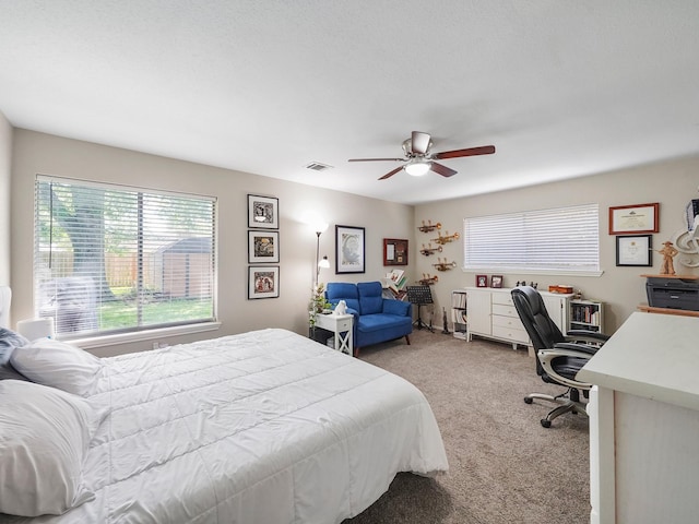 22403 Red River Dr, Katy, TX 77450 - bedroom featuring visible vents, light colored carpet, and ceiling fan