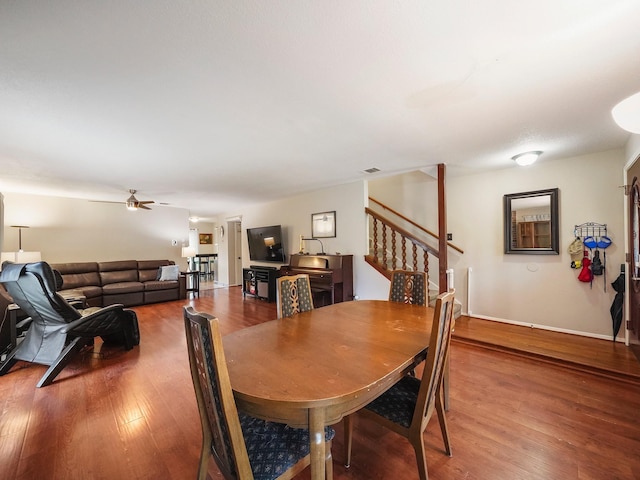 22403 Red River Dr, Katy, TX 77450 - dining room with stairway, visible vents, a ceiling fan, and wood finished floors