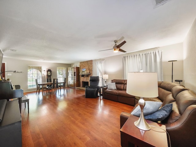 22403 Red River Dr, Katy, TX 77450 - living area featuring visible vents, a ceiling fan, and wood finished floors