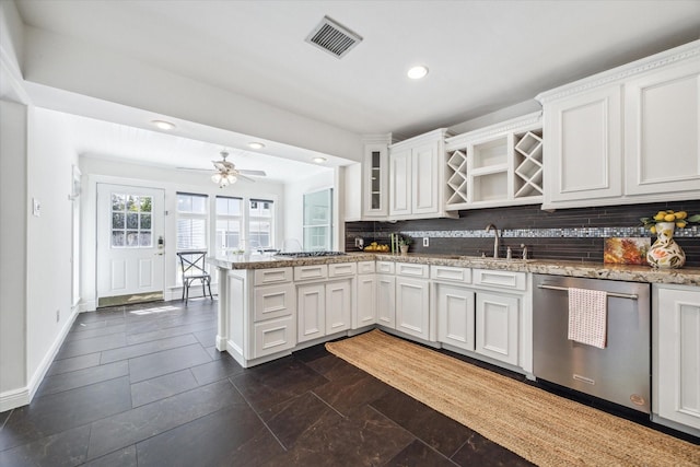 kitchen featuring tasteful backsplash, recessed lighting, a peninsula, visible vents, and stainless steel appliances