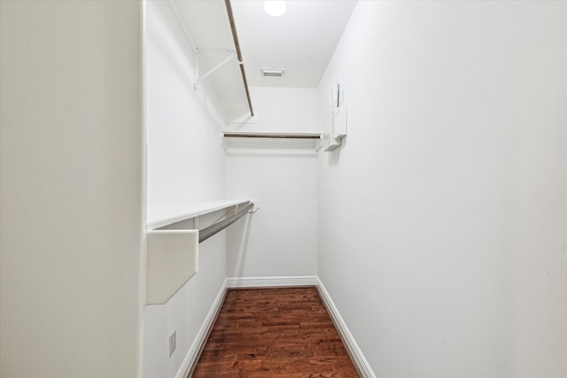 walk in closet featuring wood finished floors and visible vents