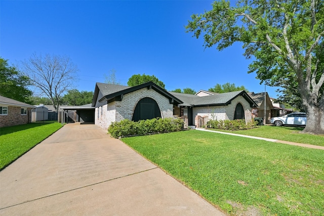 154 Camellia St, Sugar Land, TX 77478 - ranch-style house with brick siding, driveway, and a carport