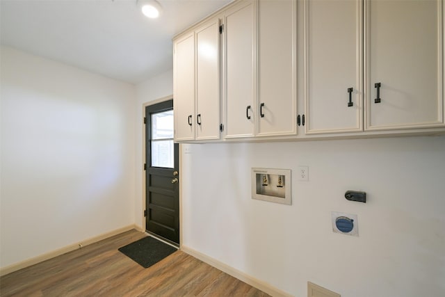 154 Camellia St, Sugar Land, TX 77478 - laundry area featuring cabinet space, hookup for an electric dryer, washer hookup, wood finished floors, and baseboards