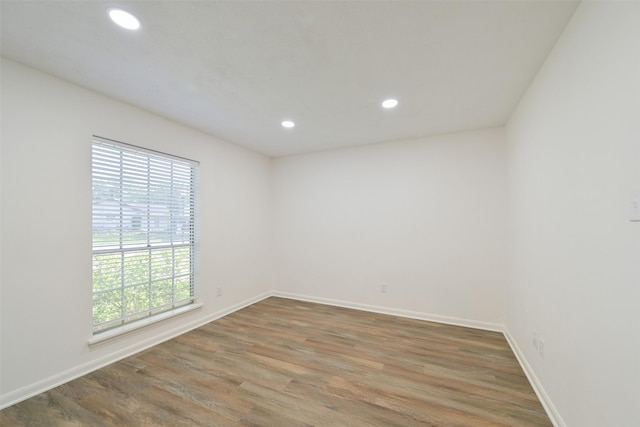 154 Camellia St, Sugar Land, TX 77478 - empty room featuring recessed lighting, wood finished floors, and baseboards