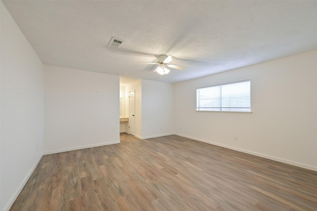 154 Camellia St, Sugar Land, TX 77478 - empty room featuring wood finished floors, ceiling fan, and baseboards