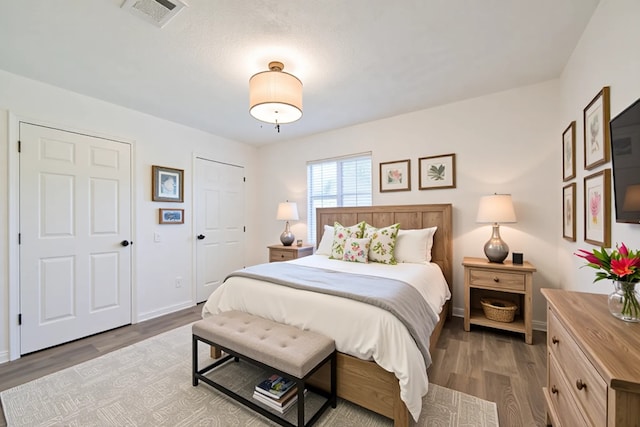 154 Camellia St, Sugar Land, TX 77478 - bedroom with dark wood finished floors and baseboards