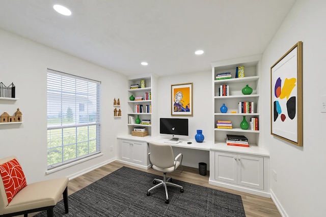 154 Camellia St, Sugar Land, TX 77478 - office area featuring light wood-style flooring, built in desk, baseboards, and recessed lighting