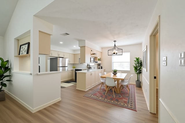 154 Camellia St, Sugar Land, TX 77478 - dining space with light wood-style floors, baseboards, a chandelier, and recessed lighting