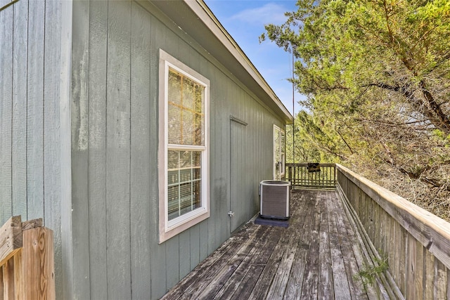 637 Troy St, Anahuac, TX 77514 - wooden deck featuring central AC