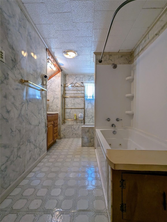 full bath featuring vanity, tile patterned floors, and a combined bath / shower with jetted tub