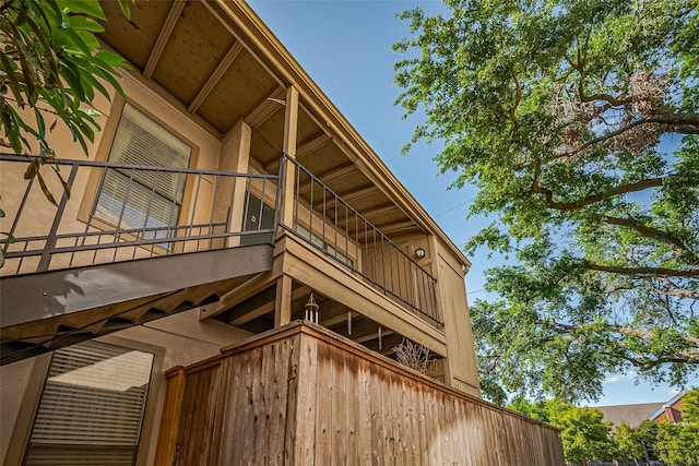 5711 Sugar Hill Dr Unit 34, Houston, TX 77057 - view of home's exterior featuring stucco siding and a balcony