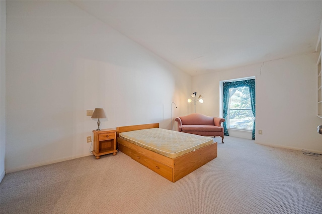 5711 Sugar Hill Dr Unit 34, Houston, TX 77057 - bedroom featuring light carpet and vaulted ceiling