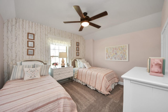 19407 Sorrel Stallion Trl, Tomball, TX 77377 - bedroom with baseboards, vaulted ceiling, wallpapered walls, dark carpet, and ceiling fan