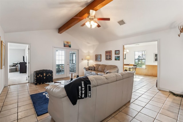 221 Kokomo Run, Point Blank, TX 77364 - living area with light tile patterned floors, ceiling fan with notable chandelier, visible vents, and a healthy amount of sunlight