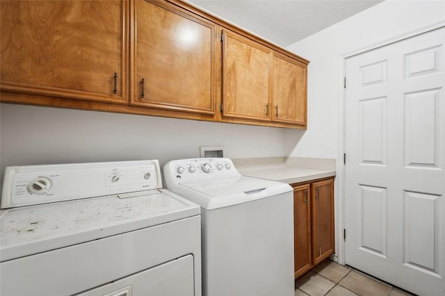 221 Kokomo Run, Point Blank, TX 77364 - washroom with cabinet space, washer and clothes dryer, and light tile patterned flooring