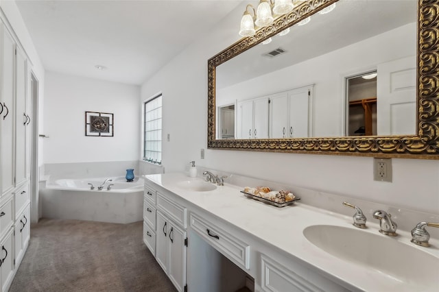 221 Kokomo Run, Point Blank, TX 77364 - full bathroom featuring a sink, visible vents, double vanity, and a garden tub