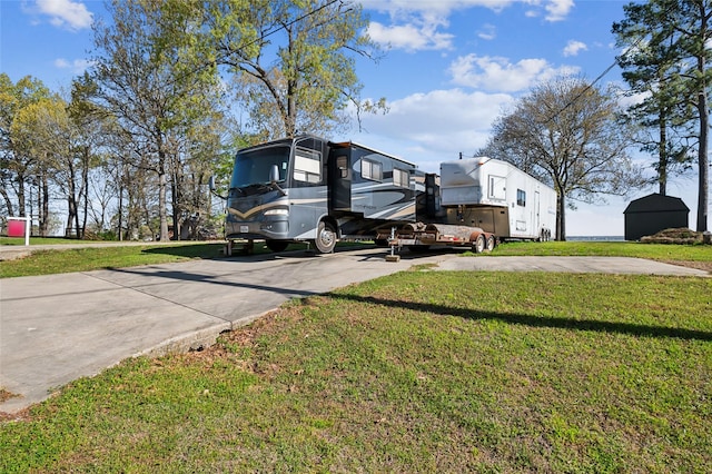 221 Kokomo Run, Point Blank, TX 77364 - view of property exterior with concrete driveway and a yard