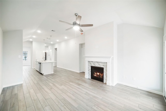 unfurnished living room with visible vents, ceiling fan, light wood-type flooring, and recessed lighting