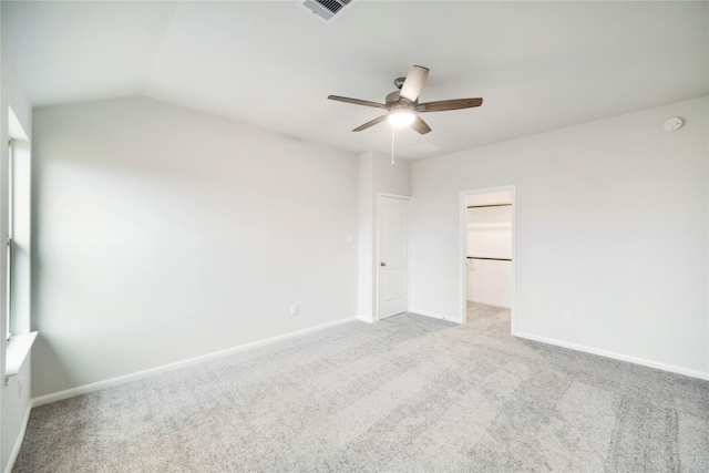 empty room with ceiling fan, baseboards, carpet, and visible vents