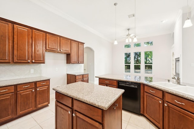 kitchen featuring tasteful backsplash, light tile patterned floors, ceiling fan, dishwasher, and a sink