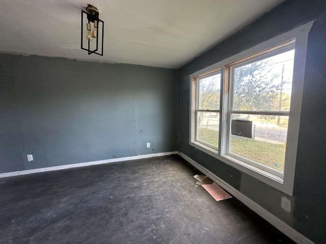 706 Gulf, San Antonio, TX 78202 - empty room with baseboards and unfinished concrete floors
