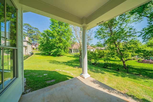 view of yard with a patio area, a residential view, and fence
