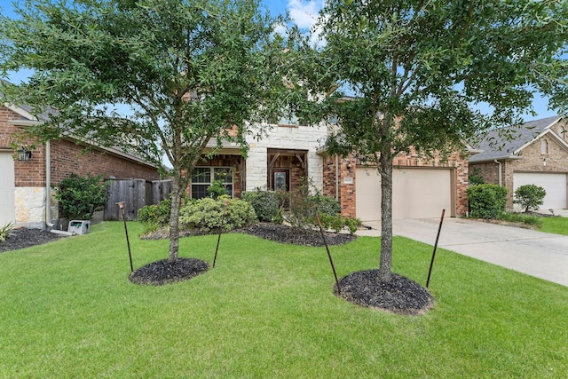 view of front of home featuring a garage, fence, a front yard, brick siding, and concrete driveway