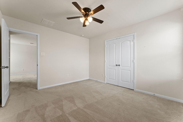 unfurnished bedroom featuring baseboards and carpet
