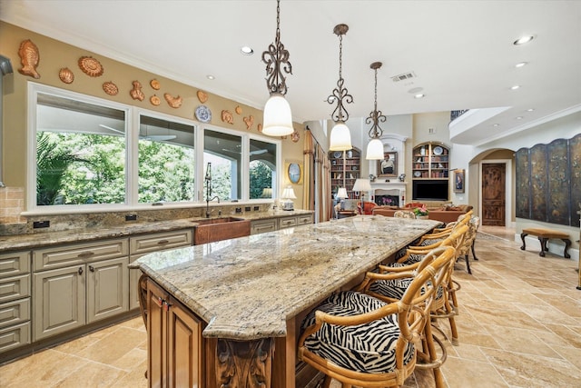 3410 Banbury Pl, Houston, TX 77027 - kitchen featuring visible vents, a sink, a kitchen island, and recessed lighting