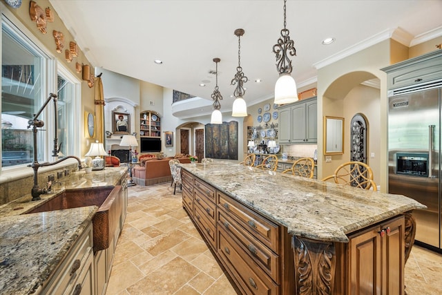 3410 Banbury Pl, Houston, TX 77027 - kitchen with recessed lighting, open floor plan, crown molding, and built in fridge
