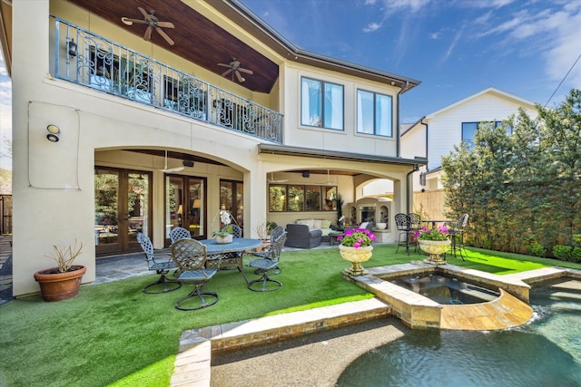 3410 Banbury Pl, Houston, TX 77027 - back of house with fence, a balcony, french doors, a ceiling fan, and a yard