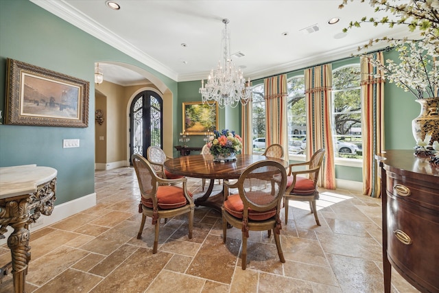 3410 Banbury Pl, Houston, TX 77027 - dining room with crown molding, arched walkways, a notable chandelier, and stone tile floors
