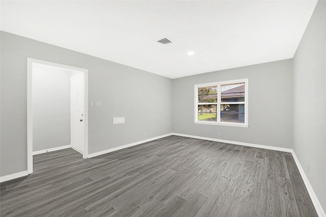 5538 Berry Creek Dr, Houston, TX 77017 - spare room with dark wood-type flooring, baseboards, and visible vents
