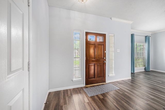 13134 Durbridge Trail Dr, Houston, TX 77065 - foyer with dark wood-type flooring, crown molding, baseboards, and a textured ceiling