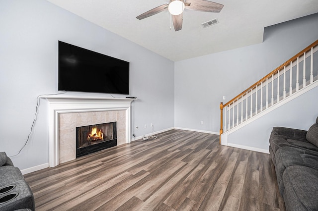 13134 Durbridge Trail Dr, Houston, TX 77065 - unfurnished living room with stairway, visible vents, baseboards, and wood finished floors