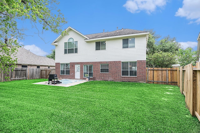 13134 Durbridge Trail Dr, Houston, TX 77065 - back of property with brick siding, a fenced backyard, a patio, and a lawn