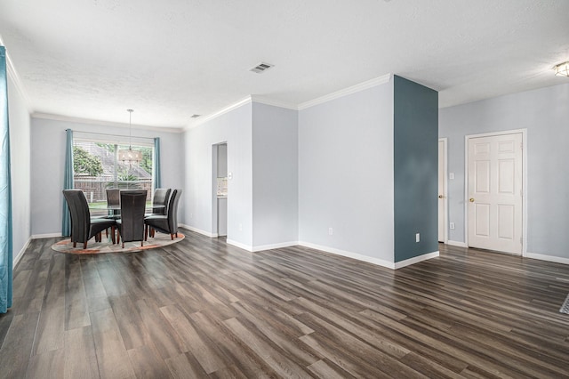 13134 Durbridge Trail Dr, Houston, TX 77065 - unfurnished dining area with a notable chandelier, visible vents, crown molding, and dark wood-style floors