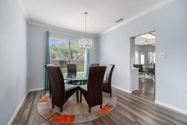 13134 Durbridge Trail Dr, Houston, TX 77065 - dining room with a healthy amount of sunlight, visible vents, an inviting chandelier, and wood finished floors