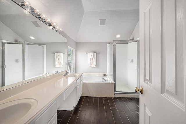 13134 Durbridge Trail Dr, Houston, TX 77065 - bathroom featuring a stall shower, a sink, lofted ceiling, and visible vents