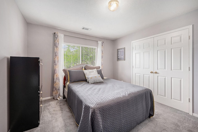 13134 Durbridge Trail Dr, Houston, TX 77065 - carpeted bedroom with visible vents, a closet, and baseboards