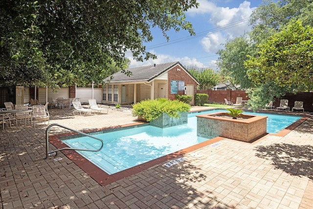 2211 S Kirkwood Rd Unit 9, Houston, TX 77077 - community pool featuring fence, a patio, an outbuilding, and a storage structure